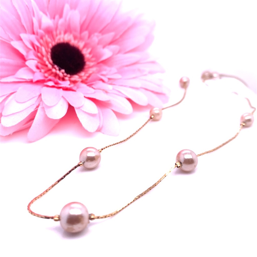 9 Pearl stations gold tone Necklace 24”
